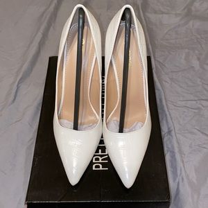 PLT White Heels in size 6.